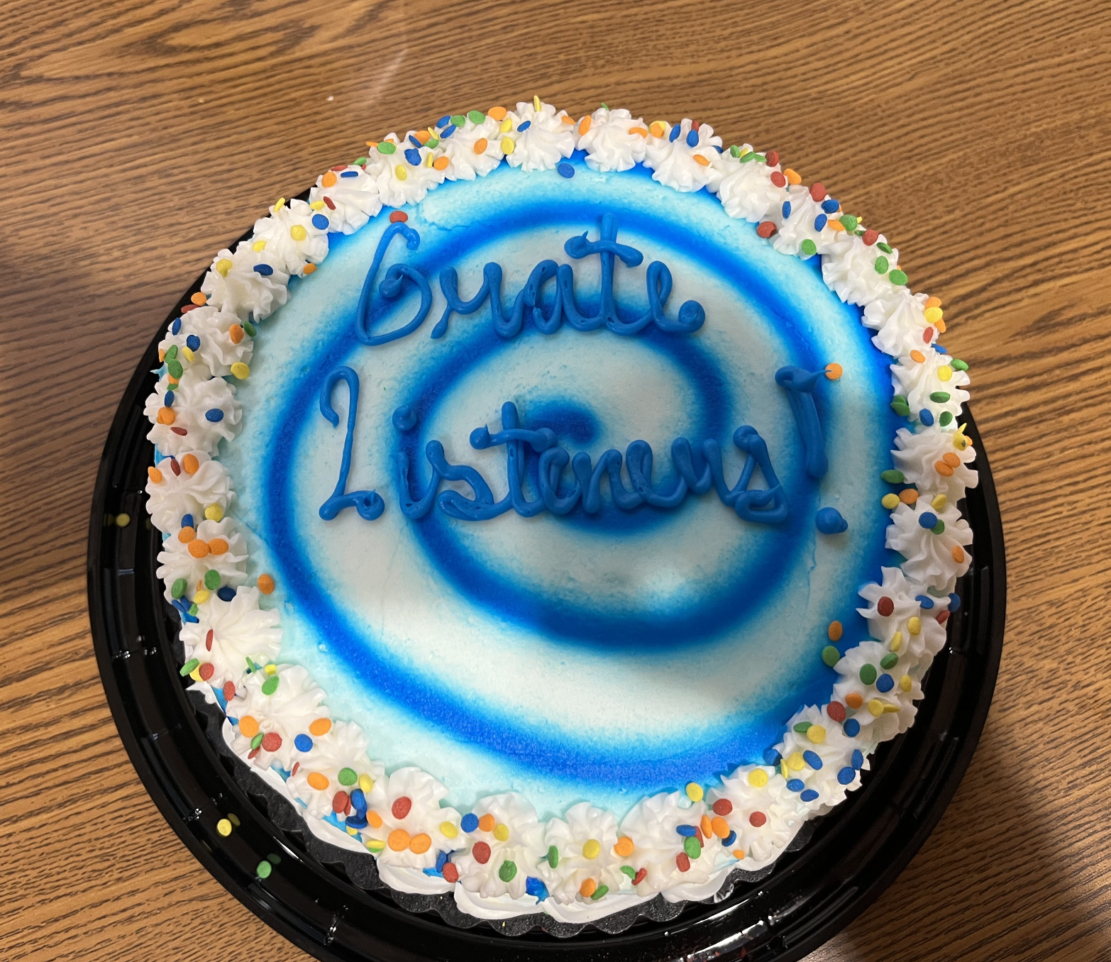 Cake decorated with the words "Grate Listeners!"