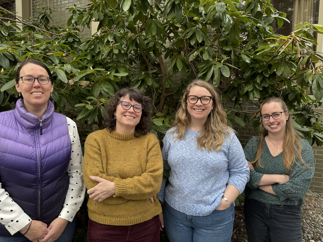 A group of four adult women on the Project Builder Support Team, from left to right: Lindsey Williams, Annie Cox, Abigail Lyon, and Lisa Wise.